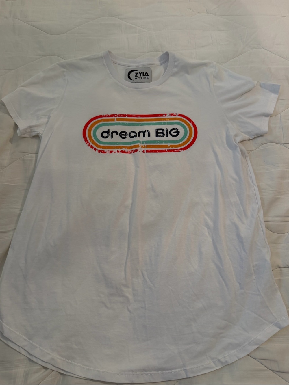 Women’s ZYIA ACTIVE White Tee with Retro 'dream BIG' Rainbow Oval Graphic